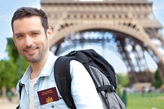 View Of A Young Attractive Traveler In Paris With Passport