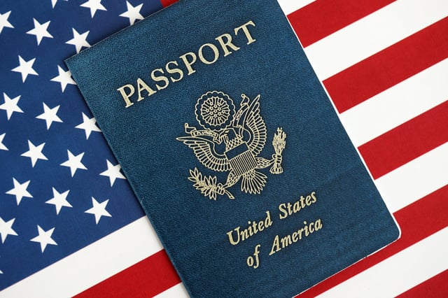 United States Passport Book On Us Flag Close Up Travel Document